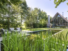 Cools Tuinaanleg bvba L'étang de baignade comme tire-l'œil